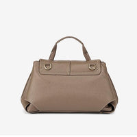 Taupe leather handbag with top handle and gold hardware on white background