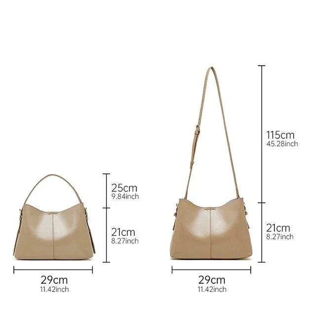 Beige leather shoulder bag with size dimensions and adjustable strap shown