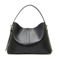 Black leather hobo handbag with gold hardware on white background