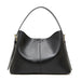 Black leather hobo handbag with gold hardware on white background
