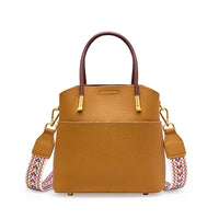 Brown leather handbag with gold hardware and patterned detachable shoulder strap