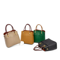 Four leather handbags in beige, tan, green, and black with brown handles on a white background