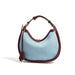 Light blue denim hobo bag with brown leather trim and short shoulder strap
