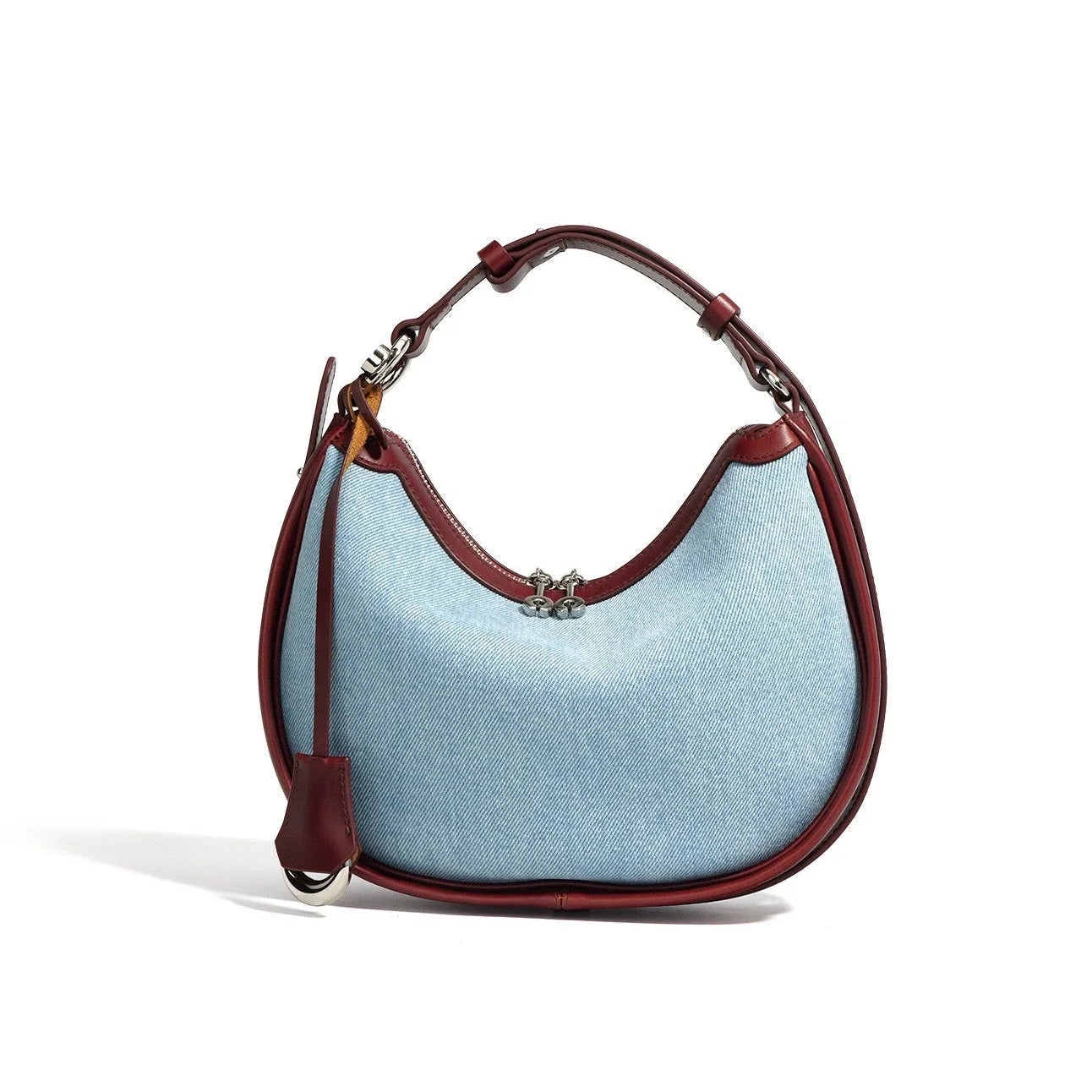 Light blue denim hobo bag with brown leather trim and short shoulder strap