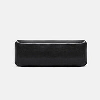 Rectangular black leather bag on white background