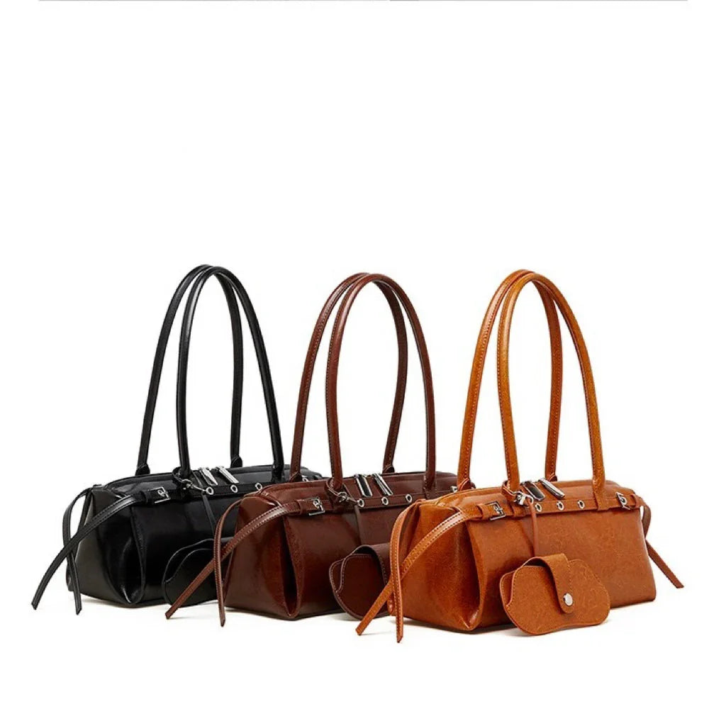 Three leather handbags in black, brown, and tan on white background, fashion accessories