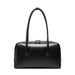 Black leather handbag with double handles and zip closure on white background