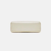 Beige rectangular leather bag bottom view on white background