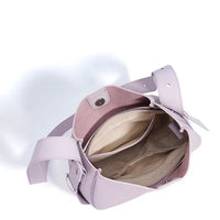 Open light purple leather handbag with beige interior and multiple compartments