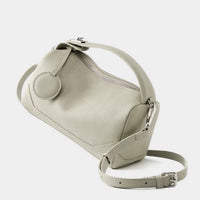 Light grey leather crossbody bag with adjustable strap and round zipper coin pouch