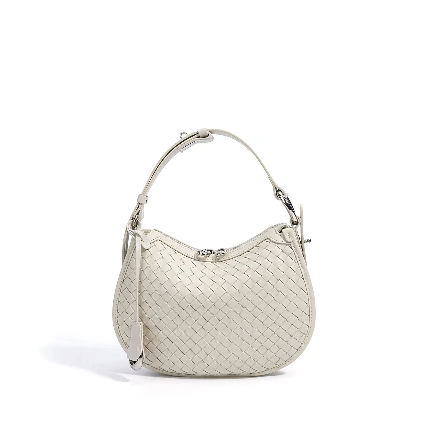 Ivory woven leather shoulder bag with silver hardware on white background