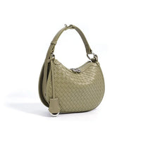 Woven olive green leather hobo bag with short strap and silver zipper on white background