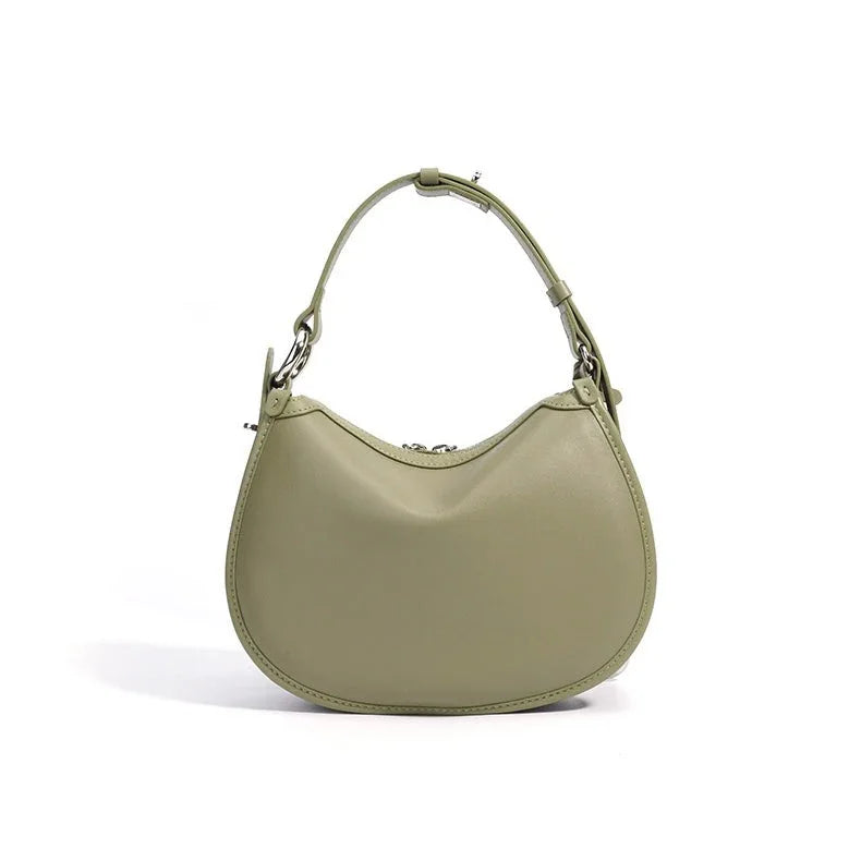 Sage green crescent shoulder bag with short handle on white background