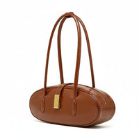 Brown leather oval handbag with double straps and gold clasp on white background