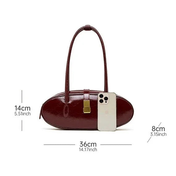 Maroon oval leather handbag with gold clasp, phone for size, bag dimensions labeled
