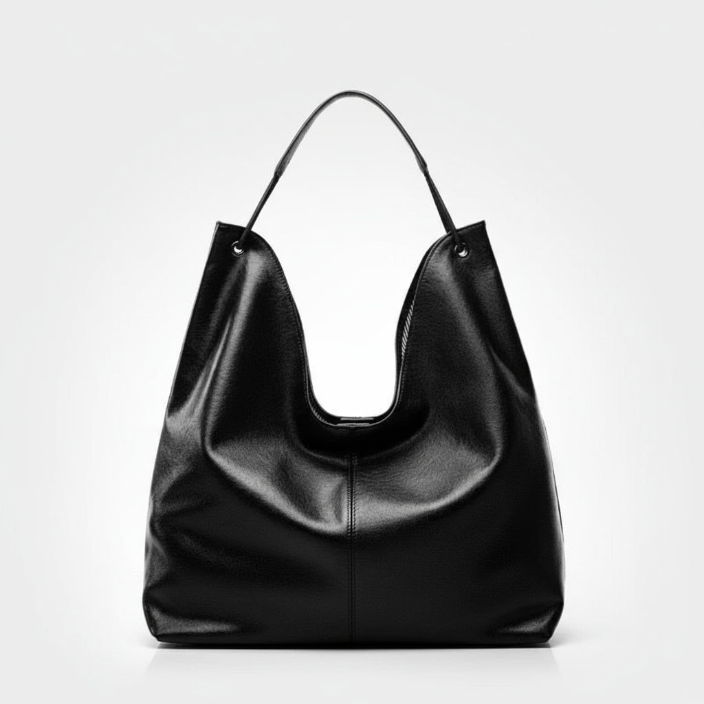 Black leather hobo bag with single handle on white background