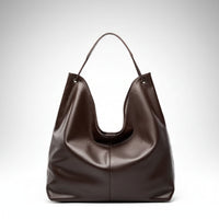 Dark brown leather hobo shoulder bag with single strap on white background