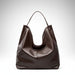 Dark brown leather hobo shoulder bag with single strap on white background