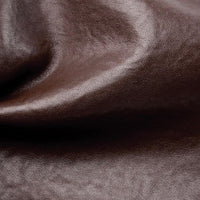 Close-up of smooth brown leather texture with subtle natural grain detail