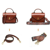Brown leather crossbody bag with gold clasp, two interchangeable straps—plain and patterned.