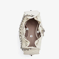 Top view of open white quilted handbag with chain strap and numbered interior pockets