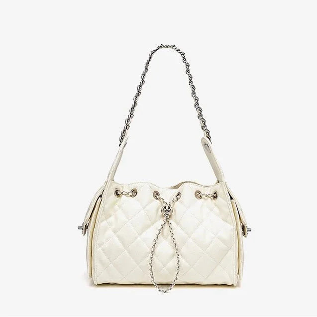 Quilted white leather shoulder bag with chain strap and silver hardware on white background