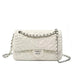White quilted leather shoulder bag with floral stitching and silver chain strap