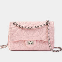 Quilted pink leather shoulder bag with silver chain strap and floral stitching detail