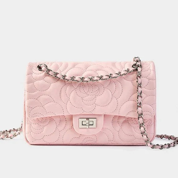 Quilted pink leather shoulder bag with silver chain strap and floral stitching detail