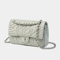 Light grey quilted leather shoulder bag with floral pattern and chain strap