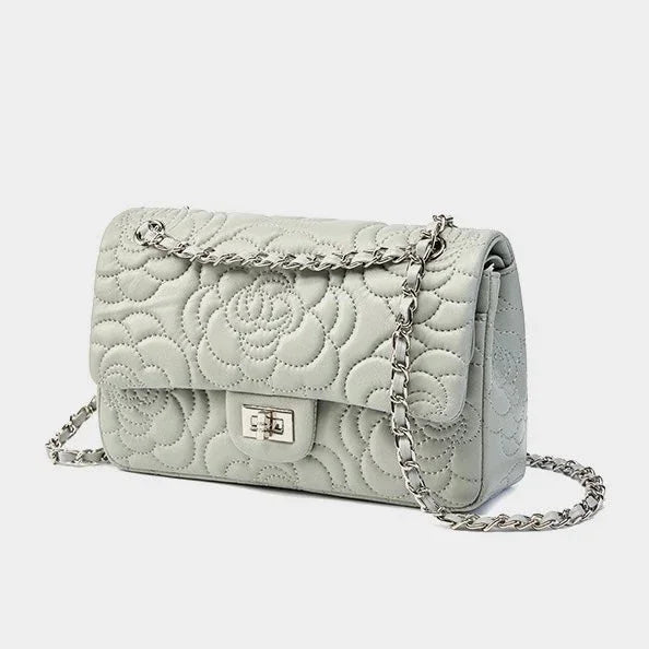 Light grey quilted leather shoulder bag with floral pattern and chain strap