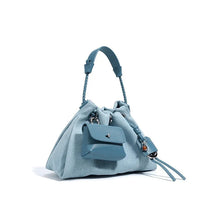Light blue drawstring handbag with braided handle and attached mini pouch