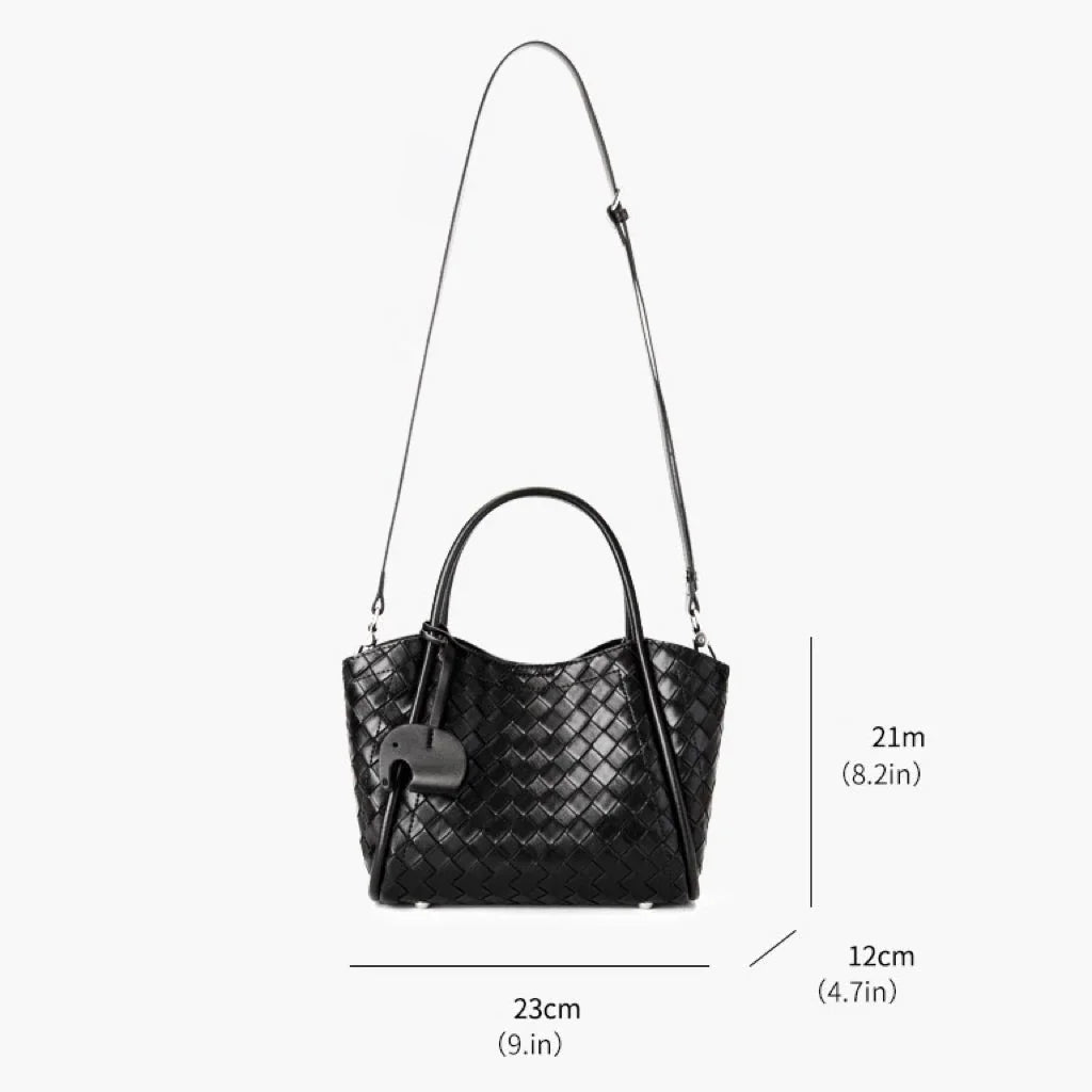 Black woven leather handbag with top handles, long strap, and size dimensions shown