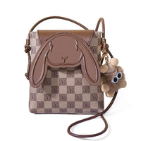 Brown checkered crossbody bag with bunny face flap and plush bear keychain charm