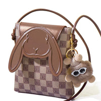 Brown checkered crossbody bag with bunny face design and plush keychain accessory