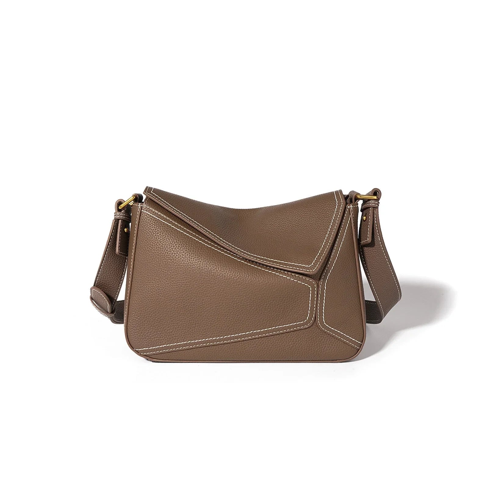 Brown leather shoulder bag with white stitching and gold hardware on white background