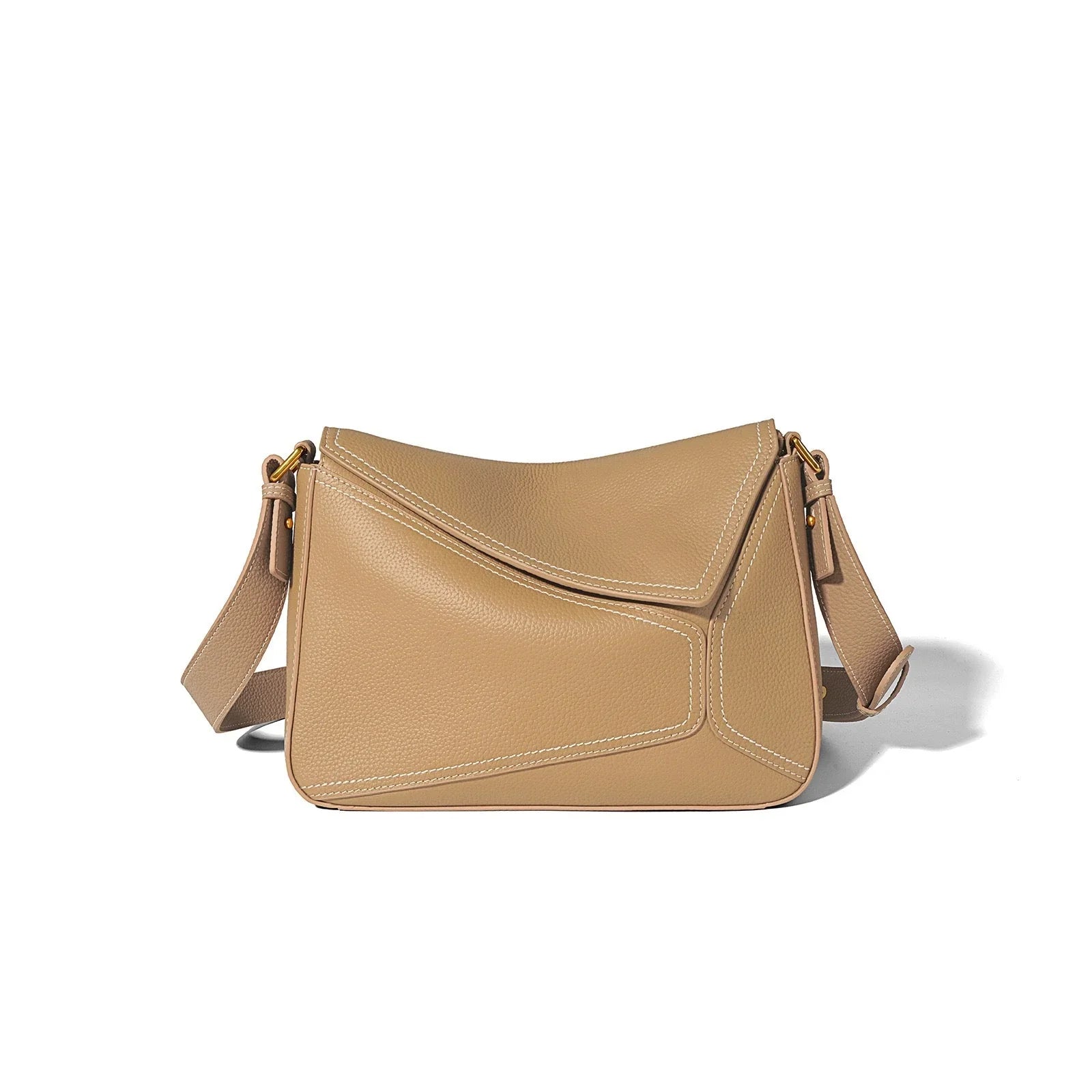 Beige leather crossbody bag with adjustable strap and geometric stitching on white background