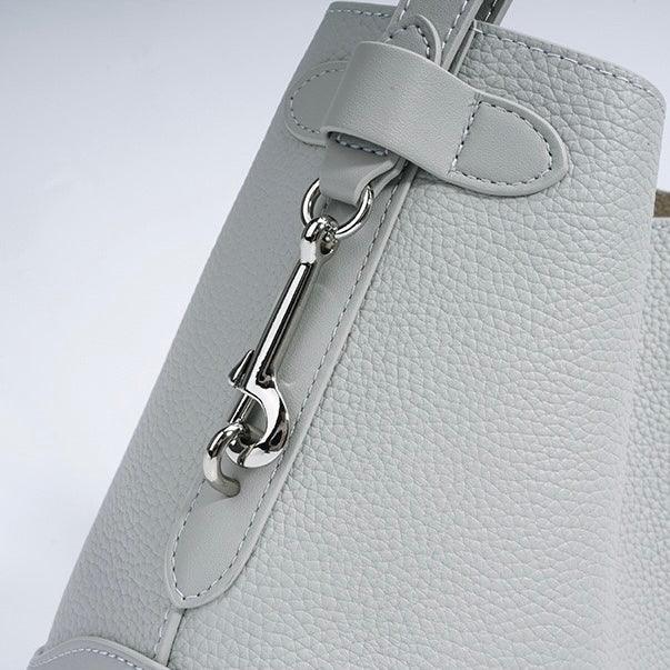 Light grey textured leather handbag with silver clasp detail