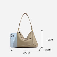 Beige leather handbag with short strap, iPhone for scale, dimensions 27x19x10cm