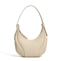 Beige leather hobo shoulder bag with zipper, minimalist design, on white background