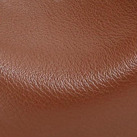 Close-up of textured brown leather surface, genuine leather material detail