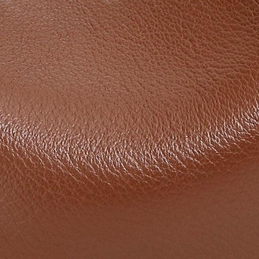 Close-up of textured brown leather surface, genuine leather material detail