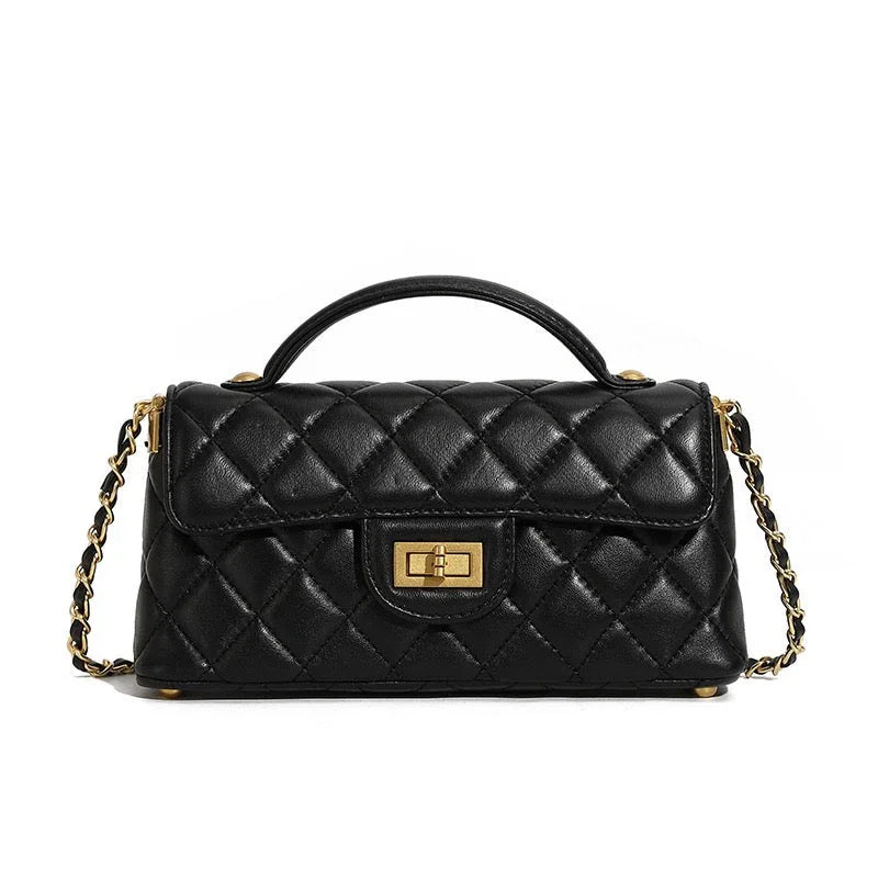 Black quilted leather handbag with gold chain strap and turn-lock closure