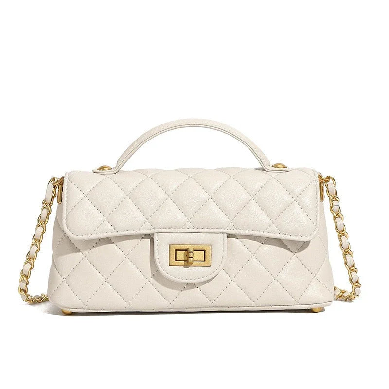 White quilted leather handbag with gold chain strap and gold turn-lock closure