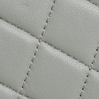 Grey quilted leather texture with diagonal stitching detail