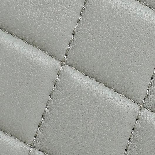 Grey quilted leather texture with diagonal stitching detail