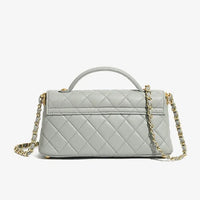 Quilted light gray leather handbag with gold chain strap on white background