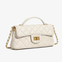 White quilted leather handbag with gold chain strap and top handle on white background