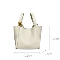 White leather tote bag with knotted handles, size 20x19x14cm, isolated on white background