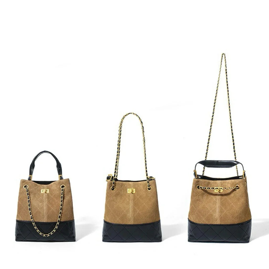 Tan and black quilted bucket bags with gold chain straps on white background